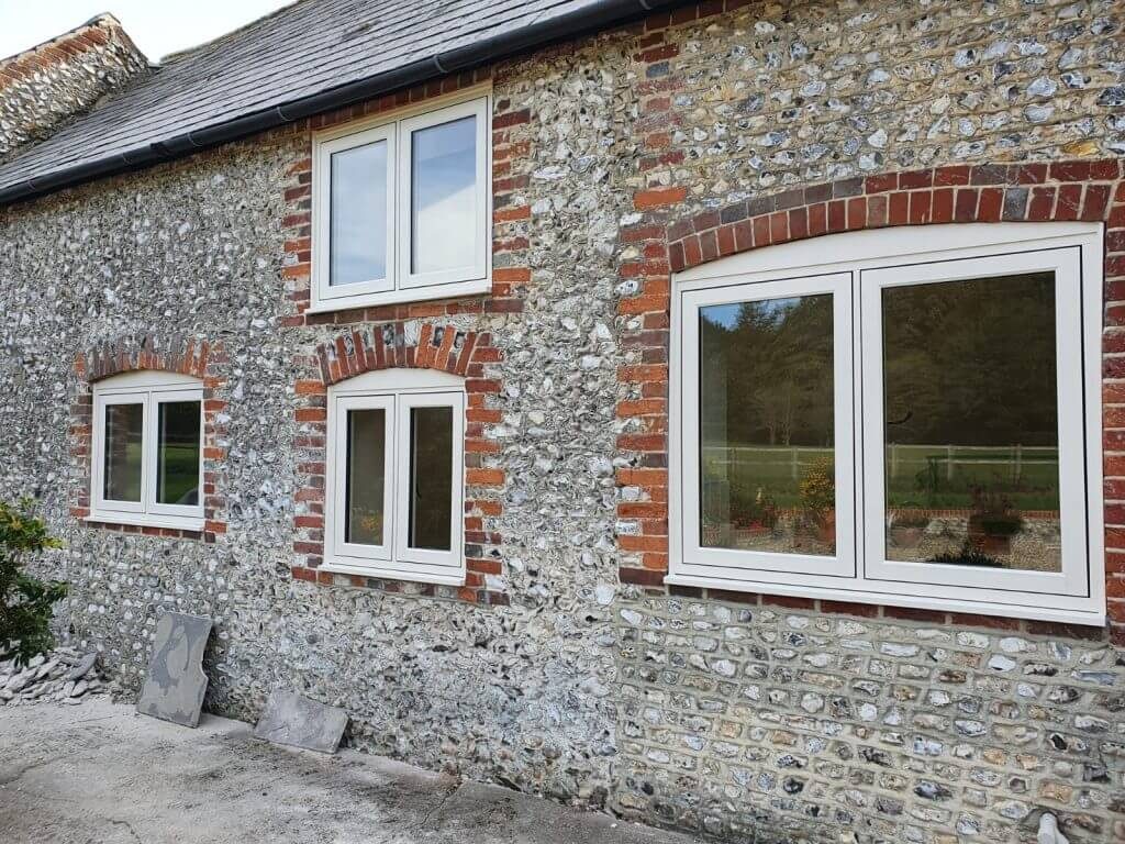 White flush sash double glazed windows on traditional home